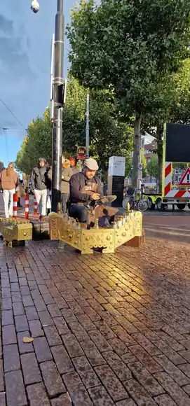 The brass shoeshine box in a public square.