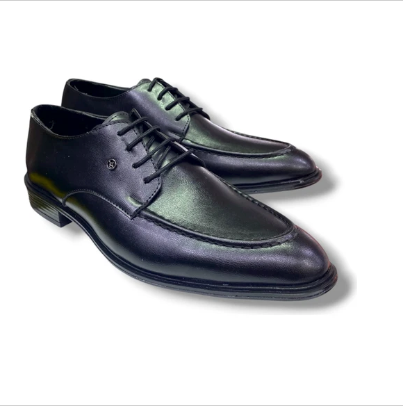 A pair of polished black leather lace-up shoes on a white background.